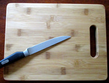 Load image into Gallery viewer, Custom Cutting Board "There's nothing more dangerous than a writer whose feelings have been hurt." Laser-engraved bamboo board Writers Gift
